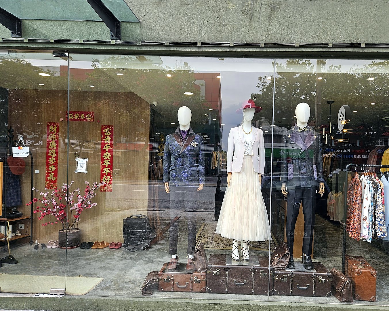 The JUNGLE Bespoke shopfront window with tailored suits on display